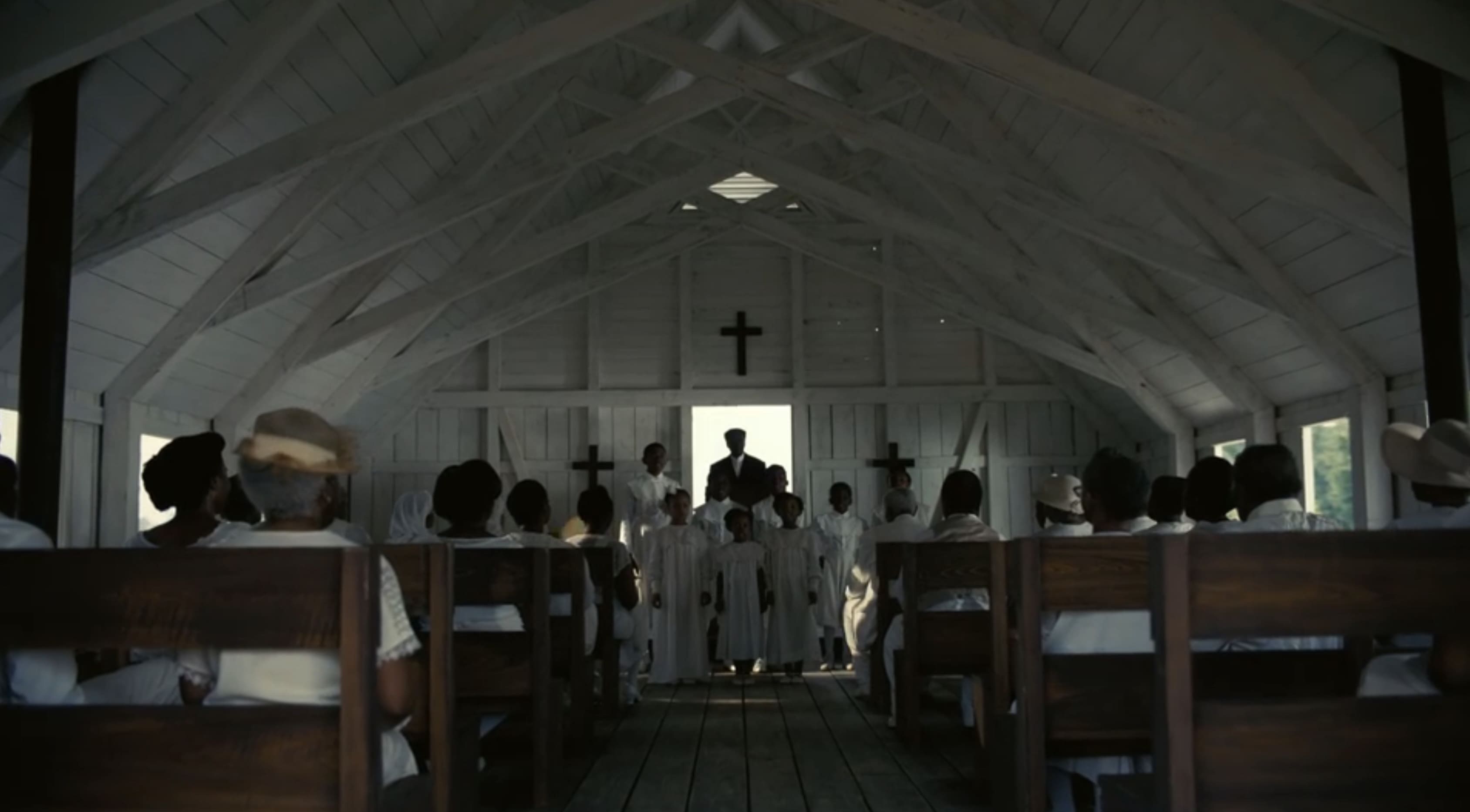 Opening scene in Sinners, Sammie Moore entering his father's church, in tatters and distraught, clutching the neck of his shattered guitar.